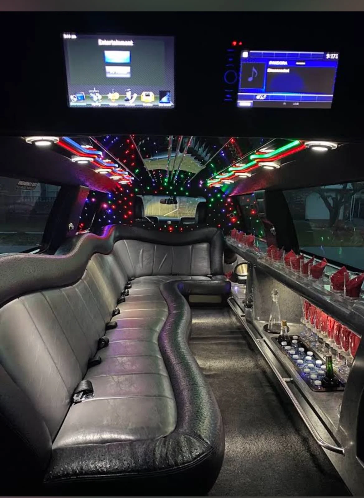 Limousine interior with leather seating, bar service and LED lighting